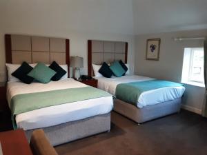 Letto o letti in una camera di Leixlip Manor Hotel