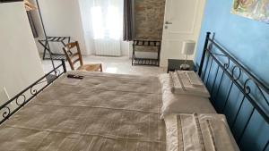 Postel nebo postele na pokoji v ubytování B&B Gronda Via Vandelli