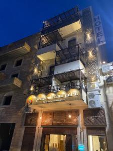 a building with a sign on the side of it at Castle beach hotel in Aqaba