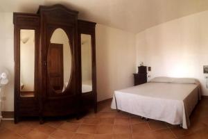 Кровать или кровати в номере Appartamento in villa Porto Pollo