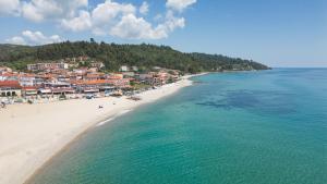 an aerial view of a beach with buildings and the ocean at Casa Maresol in Nea Skioni