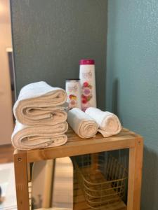 a table with towels and products on top of it at Le Mayda - Parking Privé Gratuit in Marseille