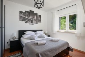 Postel nebo postele na pokoji v ubytování Apartment Villa Ma&Lu + 48 fotografií