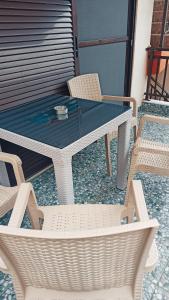 a white table and chairs on a patio at Villa Athina Gia in Sarti