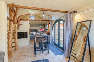 a kitchen and dining room in a tiny house at Laburnum Farm Estate in Alderton