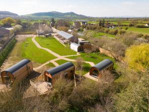 an aerial view of a bunch of buses in a field at Laburnum Farm Estate in Alderton