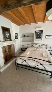Postel nebo postele na pokoji v ubytování B&B Gronda Via Vandelli