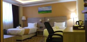 Postel nebo postele na pokoji v ubytování Holiday Hotel Addis Ababa