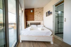 Postel nebo postele na pokoji v ubytování Lunas Alaçatı