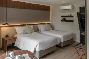 A bed or beds in a room at Five Hotel & Residences