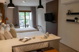 A bed or beds in a room at Five Hotel & Residences