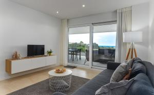 TV a/nebo společenská místnost v ubytování Via Celere 2405 Beautiful apartment with seaview