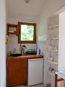 Kuchyň nebo kuchyňský kout v ubytování Apartments Almaja Villa