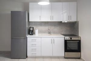 Η κουζίνα ή μικρή κουζίνα στο N&J Apartment 2 by Booking Kottas