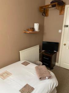 Postel nebo postele na pokoji v ubytování Belhaven Private Hotel