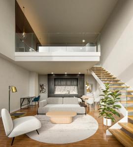 a living room with a couch and a table at I Loft Santiago by Upper Luxury Housing in Santiago de Compostela