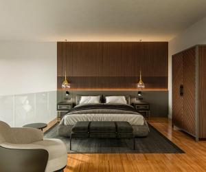 a bedroom with a large bed and two chairs at I Loft Santiago by Upper Luxury Housing in Santiago de Compostela