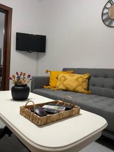 a living room with a couch and a table at GL House in Asprovalta