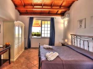 Postel nebo postele na pokoji v ubytování B&B Il Mandorleto Avola + 37 fotografií