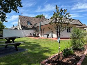 En have udenfor Kleine Villa Marleen, Ferienwohnung