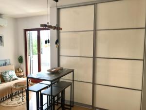 a sliding door in a living room with a table at Sara Brela Apartment in Brela