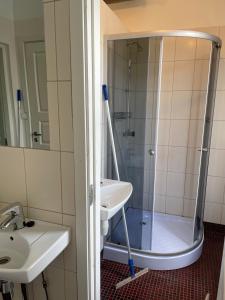 a bathroom with a shower and a sink at Hilda Villa in Viljandi +25 photos