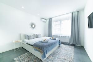 Katil atau katil-katil dalam bilik di Belgrade CITY CENTER Apartments