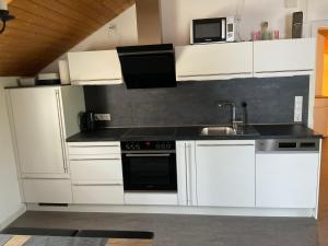 Kuchyň nebo kuchyňský kout v ubytování Apartment Auszeit