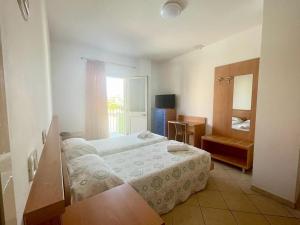 Voodi või voodid majutusasutuse Hotel Vianello toas