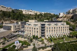 an aerial view of a large building in a city at Hotel Yehuda in Jerusalem