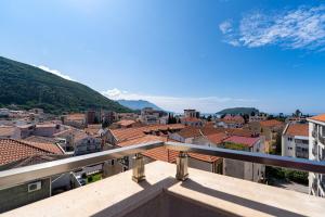 a view of a city from a balcony at Marea Apartments Budva in Budva