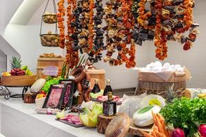 a table filled with food and a chandelier at Marti Resort Deluxe Hotel in Marmaris