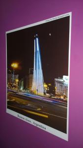 a picture of a building in a city at night at Koten Hotel in Buenos Aires