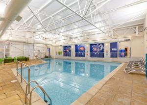 a large indoor pool with a large swimming pool at Late Rooms at North Devon Resort in Ilfracombe