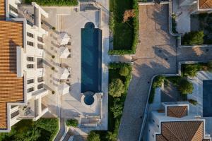 an overhead view of a building with a pool at Eterno Villas in Budva