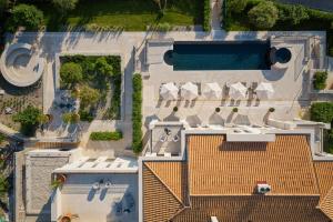 an aerial view of a house with a swimming pool at Eterno Villas in Budva