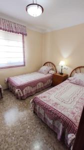 Llit o llits en una habitació de Piso Vélez Málaga