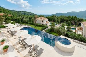 a villa with a view of a swimming pool at Eterno Villas in Budva +72 photos