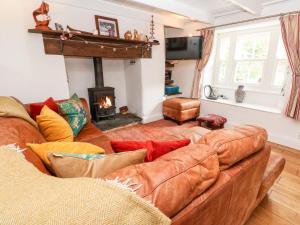 Posezení v ubytování Honeysuckle Cottage