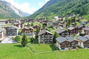 a small village in the mountains with houses at Relaxing Loft Haven near Zermatt - Parking Free in Täsch