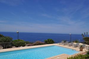 a swimming pool with a view of the ocean at Le Saint Erasme, Hotel Eco Friendly in Calvi