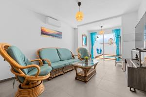 a living room with chairs and a couch and a table at Home2Book Charming Private Pool Puerto del Carmen in Tías