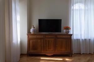 TV a/nebo společenská místnost v ubytování IBibiena - CASA CAMPALDINO