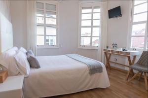 Posteľ alebo postele v izbe v ubytovaní Hostal Zahara