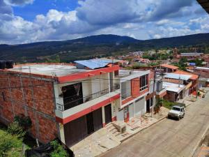 an overhead view of a city with a building at Mi Techito Curiteño in Curití