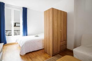 En eller flere senge i et værelse på Nice flat in the 11th district of Paris - Welkeys