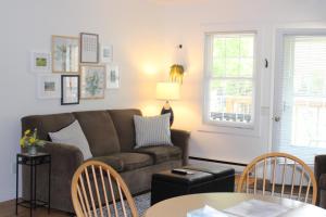 a living room with a couch and a table at Cedar Court Inn in Fish Creek