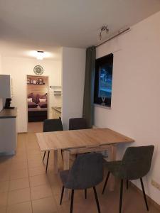 a dining room with a wooden table and chairs at Ferienwohnung Lina mit toller Terrasse im Schwarzwald in Bernau im Schwarzwald