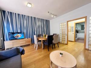 TV a/nebo společenská místnost v ubytování Gracia Village Barcelona