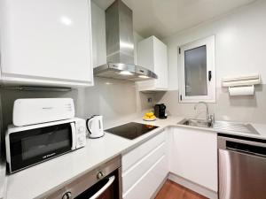 Kuchyň nebo kuchyňský kout v ubytování Gracia Village Barcelona